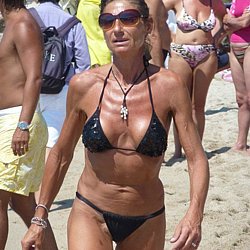 Nude mature woman at nudist beach