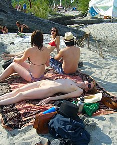 With bald pussy young female nudists spreads legs on nude beach in turkey