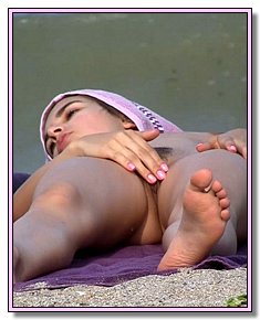 sympathetic teeny nudists loves to push the legs on ukraine nude beach