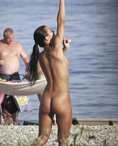 With bald pussy young female nudists enjoys being naked at florida nude beaches