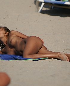 lovely teen amateurs takes sun-bath on the beaches of Crimea